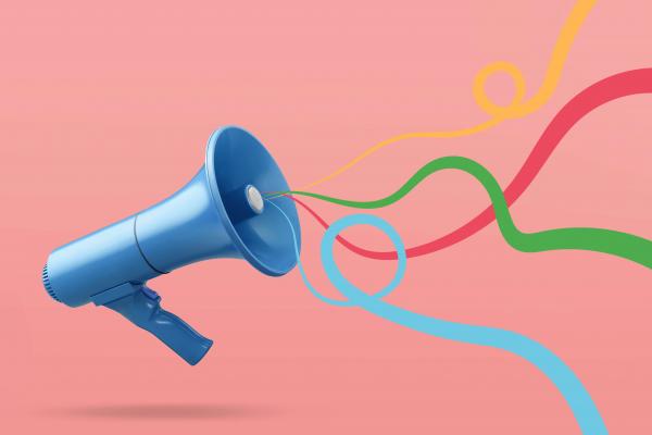 An illustration of a megaphone with colorful ribbons streaming out. 