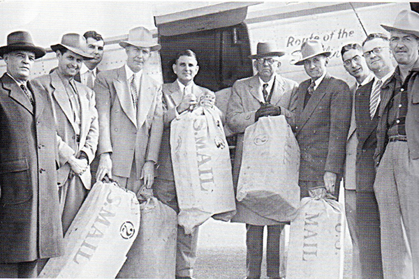 Roy M. Bird, the author’s grandfather (far right) attends the opening of airmail service to Magnolia, Ark., 1952.