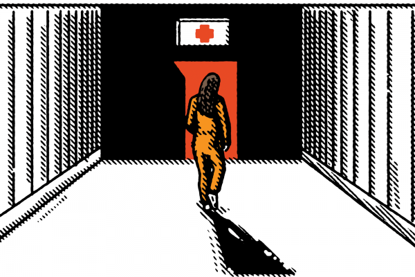 A woman wearing an orange jumpsuit walks down a hallway toward a door with a first-aid symbol over it.