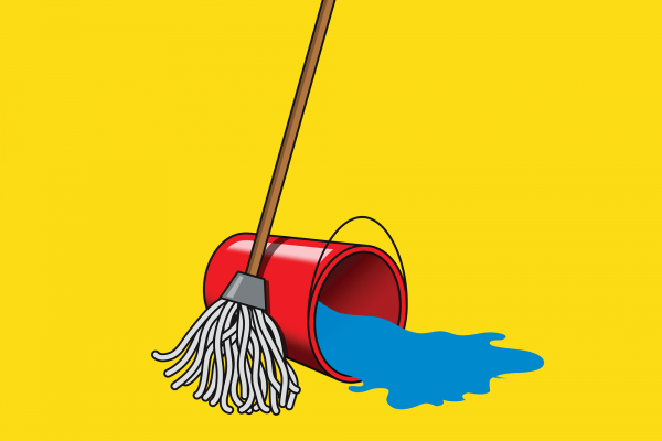 A mop stands next to a red bucket of water that is tipped over and spilling water.