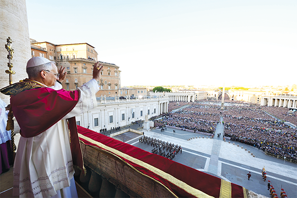 Newly elected Pope Leo XIV waves to the crowd.