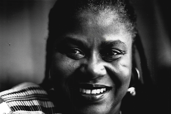 Black and white photo of Bernice Johnson Reagon smiling into the camera.