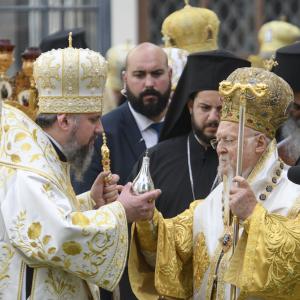 Ecumenical Patriarch Bartholomew hands over a vessel of myrrh to the Head of the Orthodox Church of Ukraine Epiphanius during a religious service near St. Sophia Cathedral in Kyiv, Ukraine on Aug. 22, 2021