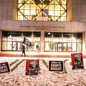 Protest signs outside the Hennepin County Government Center