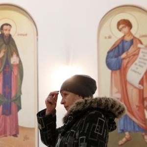 A woman attends church in Kyiv, Ukraine