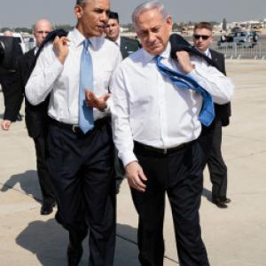President Barack Obama walks across the tarmac with Israeli Prime Minister Benja