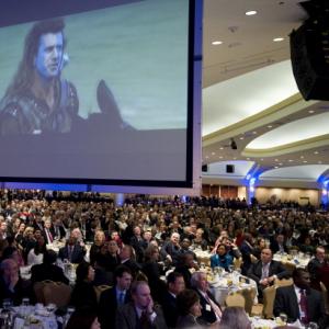 Scene from "Braveheart" is projected at the 2011 National Prayer Breakfast. 