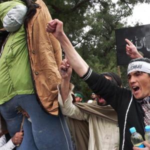 Demonstrators carry effigy of President Obama during a protest of a US soldier's