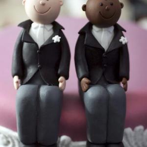 Wedding cake topper photo by Christopher Furlong/Getty Images.