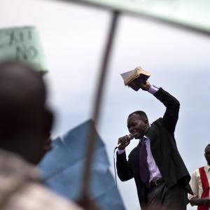 Man holding Bible speaks during anti-homosexuality rally in Kamapala, Uganda 