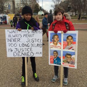 Two young women join the march on Monday January 19. Image courtesy Charissa L