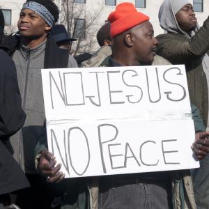 A protester holds a sign at the Justice for All march on Saturday in Washington.