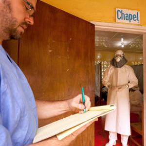 Kent Brantly of Samaritan’s Purse, right, gives orders for medication. Ima