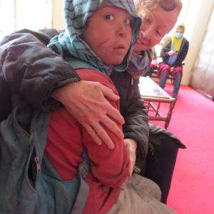 Kathy Kelly with Safar, an Afghan “street child”