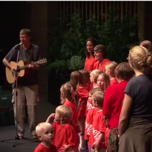 Bryan Moyer leading children in song