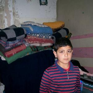  Syrian boy in rented flat in Mafraq, Jordan. MCC Photo/Nada Zabeneh