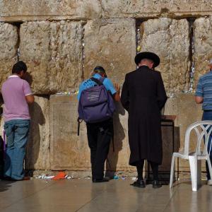 Tourists pray at the Wailing Wall in Jerusalem. Via Wylio http://bit.ly/wsudSt.