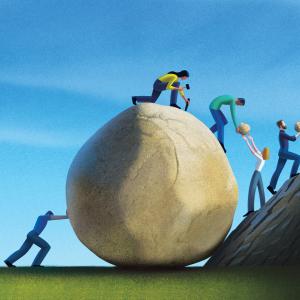 Humans working together to take apart a giant boulder into pieces to carry it up a mountain.