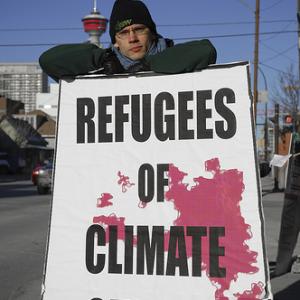 Demonstrator at a climate change rally in Calgary, Canada, 2007. Image via Wylio