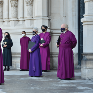 Photo of a gathering of Episcopal leaders outside St. John the Divine Cathedral.