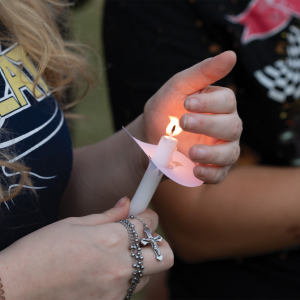 People gather at Apalachee High School in Winder, Ga., after a 14-year-old student killed four people and injured at least nine more.