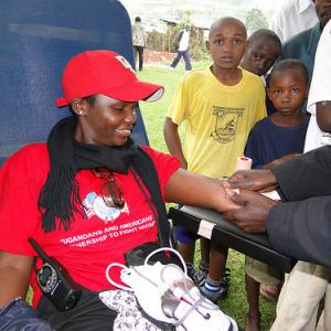 A Ugandan woman undergoes an HIV test in a program funded by PEPFAR. Image via W