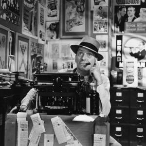 Photo: Man thinking at typewriter, Everett Collection / Shutterstock