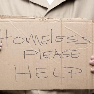 Homeless person asking for help, Kim Reinick / Shutterstock.com