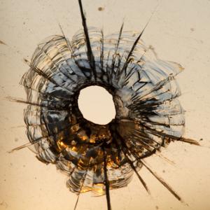 Gun shot in window, Iurii Konoval / Shutterstock.com