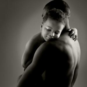 Father and son embrace. Photo courtesy stefanolunardi/shutterstock.com