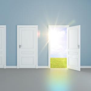 A door opens to light. Image courtesy Peshkova/shutterstock.com