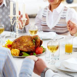 Photo: Family holiday meal, © Pressmaster / Shutterstock.com