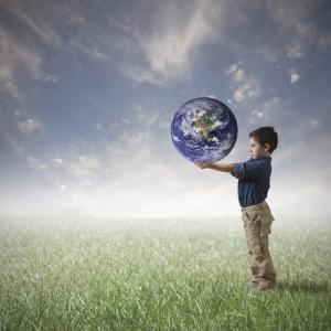 Young boy trying to save the world, alphaspirit / Shutterstock.com