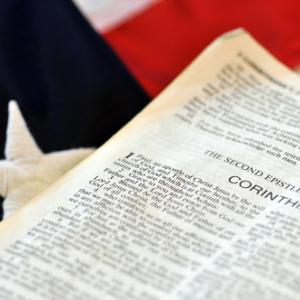 Bible and flag, JustASC / Shutterstock.com
