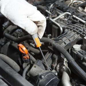 Mechanic performing the maintenance of a motor vehicle. Photo via Shutterstock/fotoedu