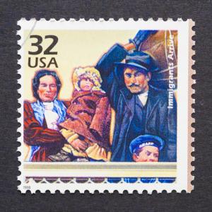 Stamp of an immigrant family. Photo courtesy catwalker/shutterstock.com