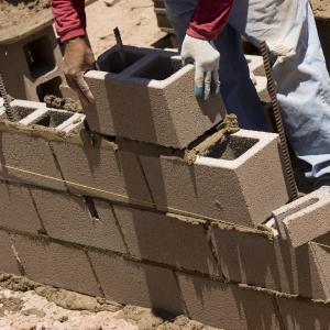 Cinder brick laying, Lou Oates / Shutterstock.com