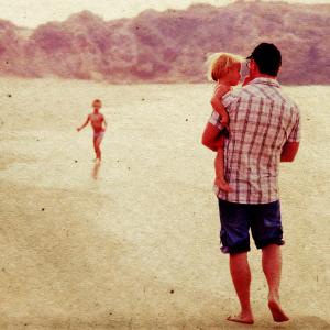 Father with two daughters, Dubova / Shutterstock.com