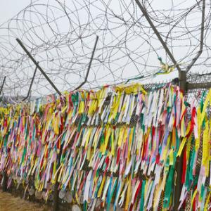 Prayer ribbons hung on the wall in South Korea, meunierd / Shutterstock.com