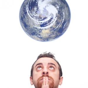 Man praying for the earth, Gandolfo Cannatella / Shutterstock.com