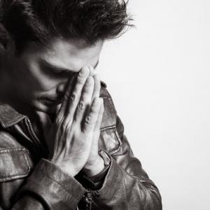 Man praying, KieferPix / Shutterstock.com