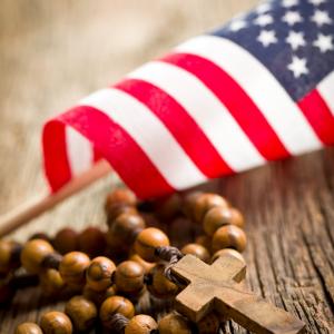 Cross and flag. Image via Jiri Hera/shutterstock.com