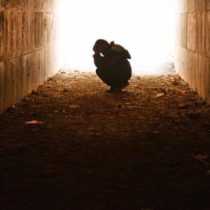Child alone in a tunnel,  hikrcn / Shutterstock.com