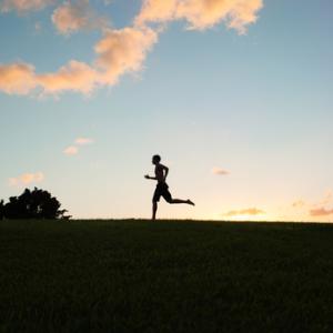 Silhouette of young man running, KieferPix / Shutterstock.com