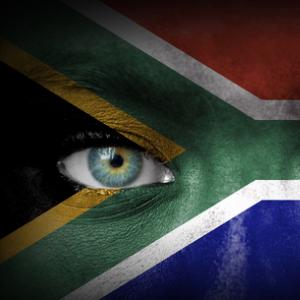 South African flag over human face, Aleksandar Mijatovic / Shutterstock.com