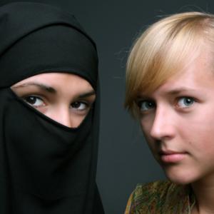 Muslim and Christian women, Anna Jurkovska / Shutterstock.com