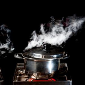 Two pots reach the boiling point. Image courtesy Showcake/shutterstock.com