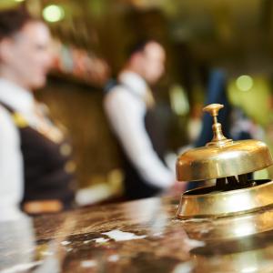 An inn's reception counter with bell. Image courtesy Dmitry Kalinovsky/shutterst