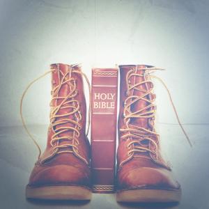 Bible and boots, Paul Matthew Photography / Shutterstock.com