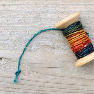 Spool of old thread. Image via TAGSTOCK1/shutterstock.com